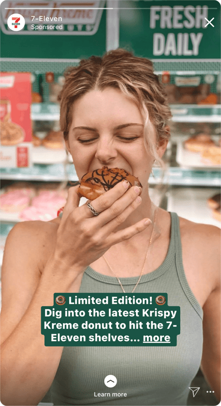 Screenshot of Instagram Story ad with a woman eating a donut with some text overlaid ontop