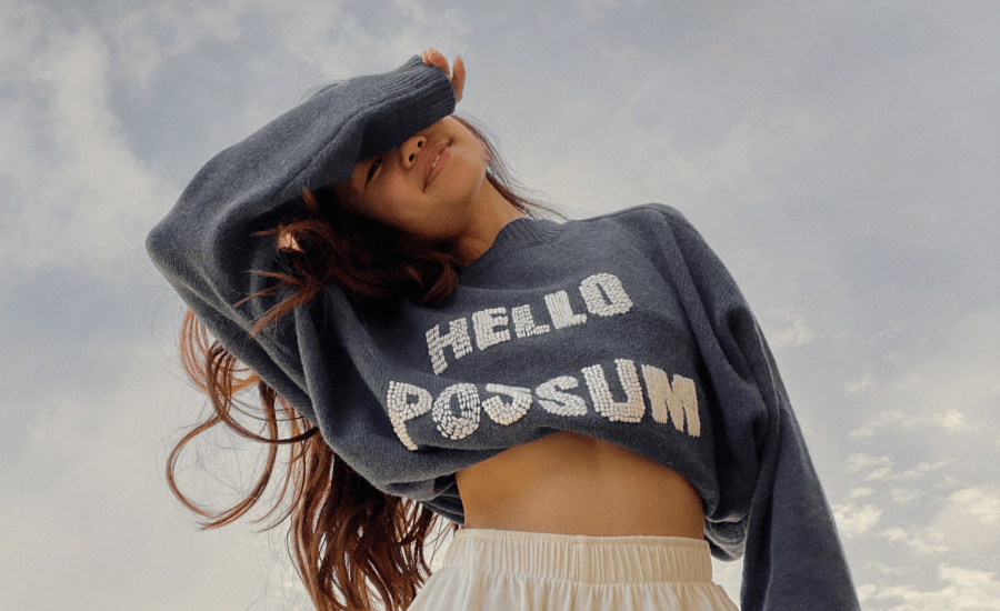 Woman wears a jumper that says